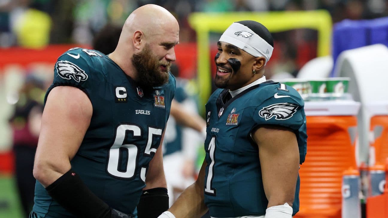 Philadelphia Eagles offensive tackle Lane Johnson (65) shakes hands with quarterback Jalen Hurts (1) during the second half of Super Bowl LIX at Caesars Superdome.